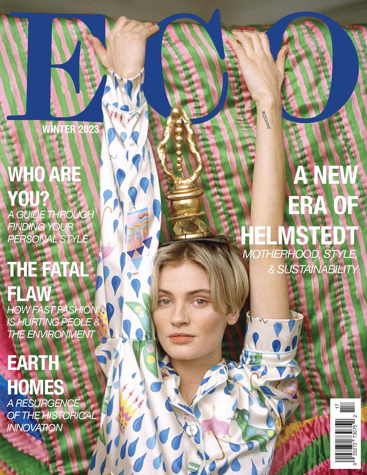 ECO Winter 2023 Magazine cover. A model sits with arms stretched over eco logo, a gold trophy-like sculpture balances on her head. She wears colorful Emilie Helmstedt pajamas in front of green and pink striped fabric.